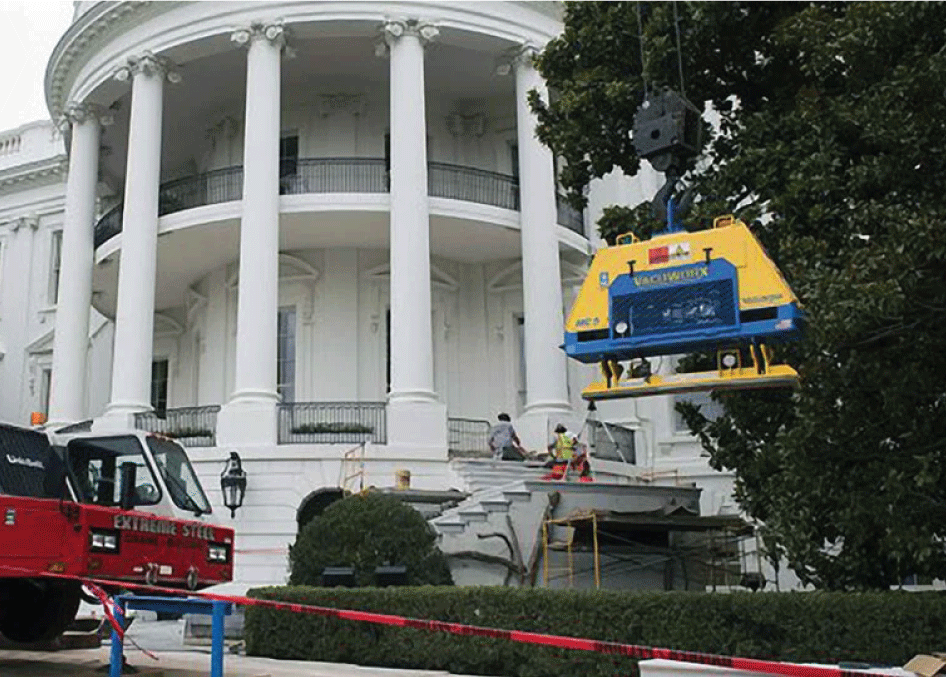 A vacuworx lifter being used to lift concrete at the Whitehouse. Vacuum lifting is a safer and efficient material handling solution for concrete.